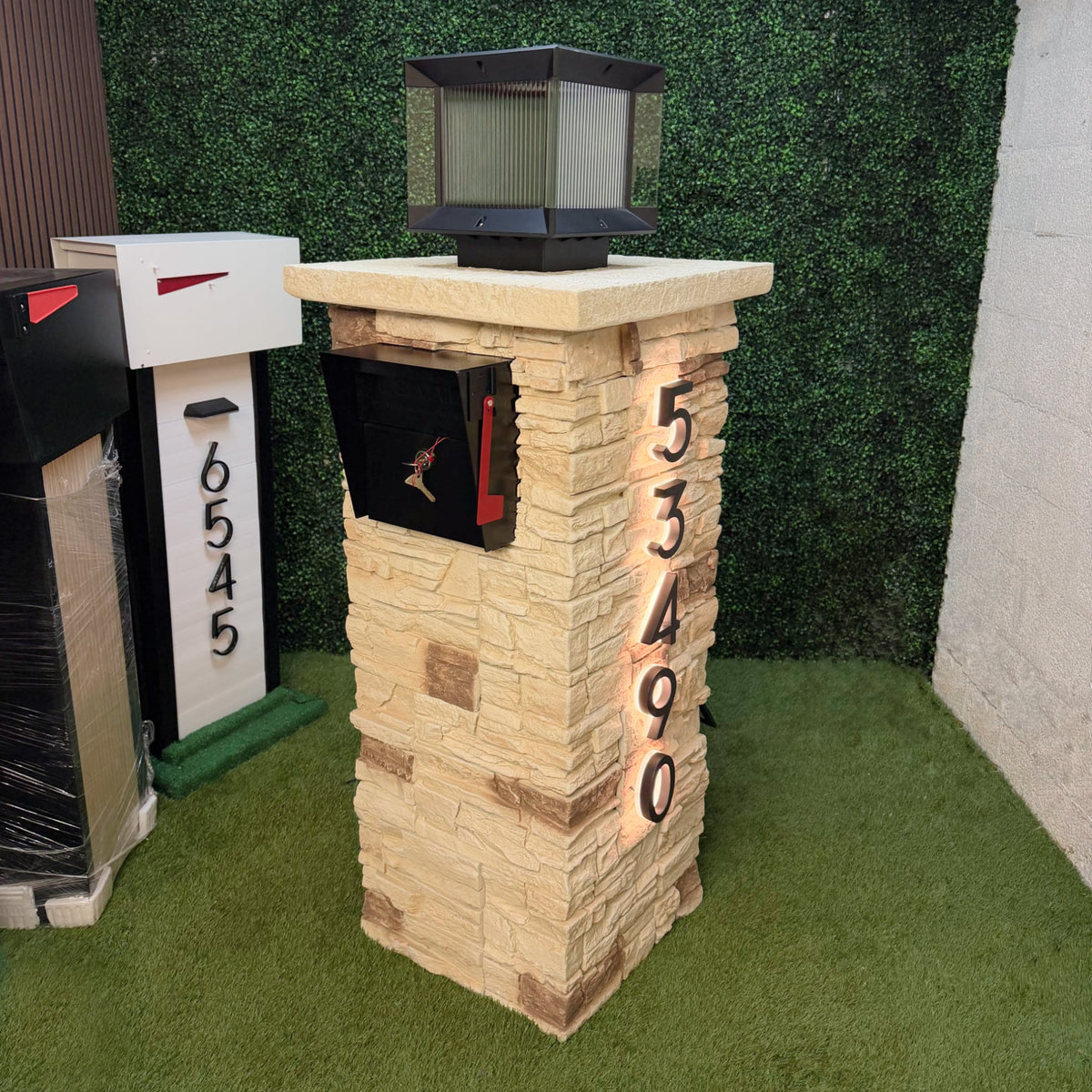 A faux pillar mailbox surround at a residential curb
