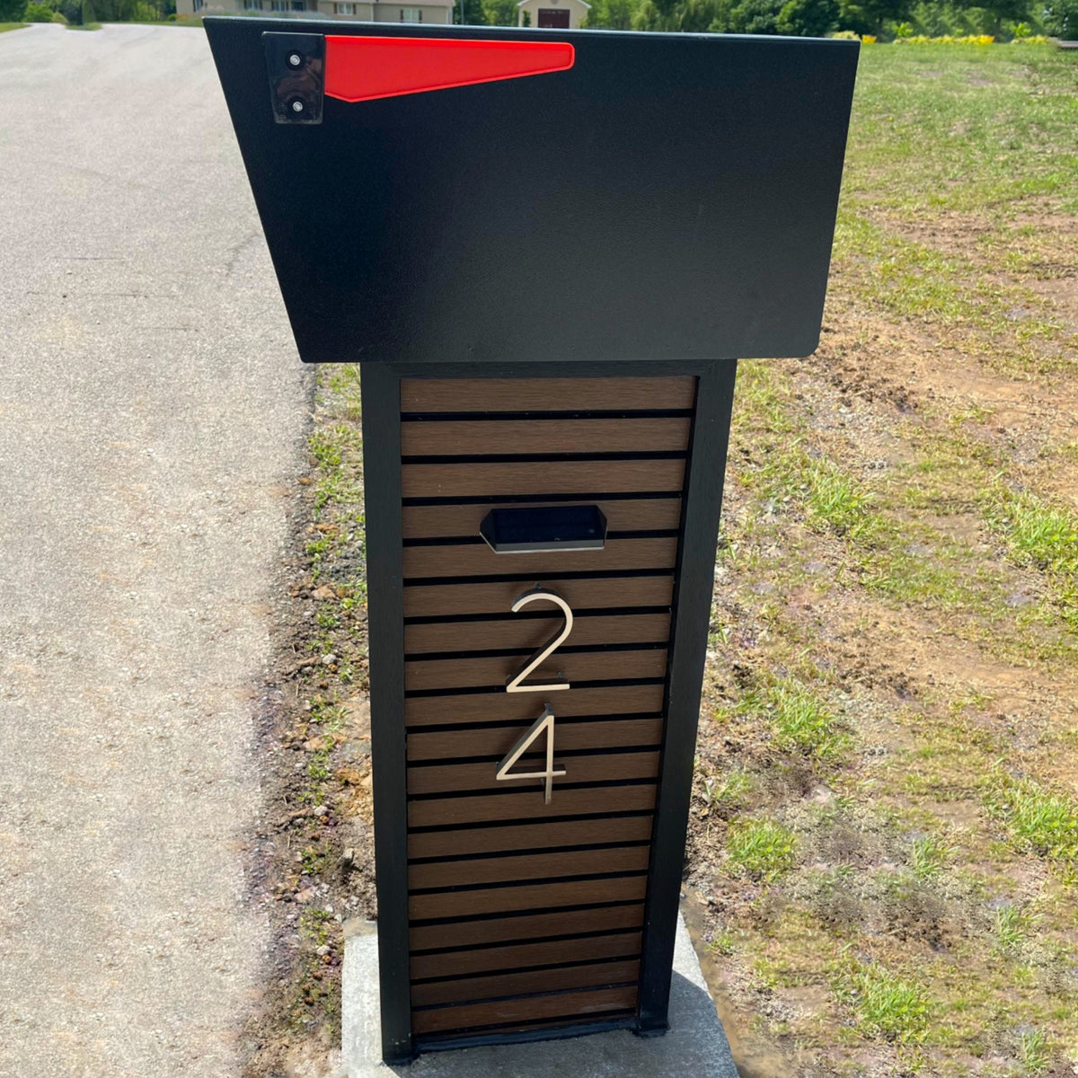 A locking parcel drop box at the curb of a modern home